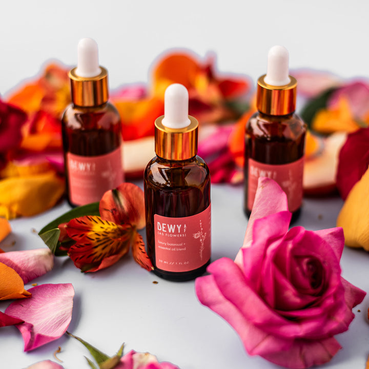 Dewy AF Facial Serum, a handcrafted facial serum. Floral and fruity scent with jojoba oil, rosehip seed oil, and vitamin E.