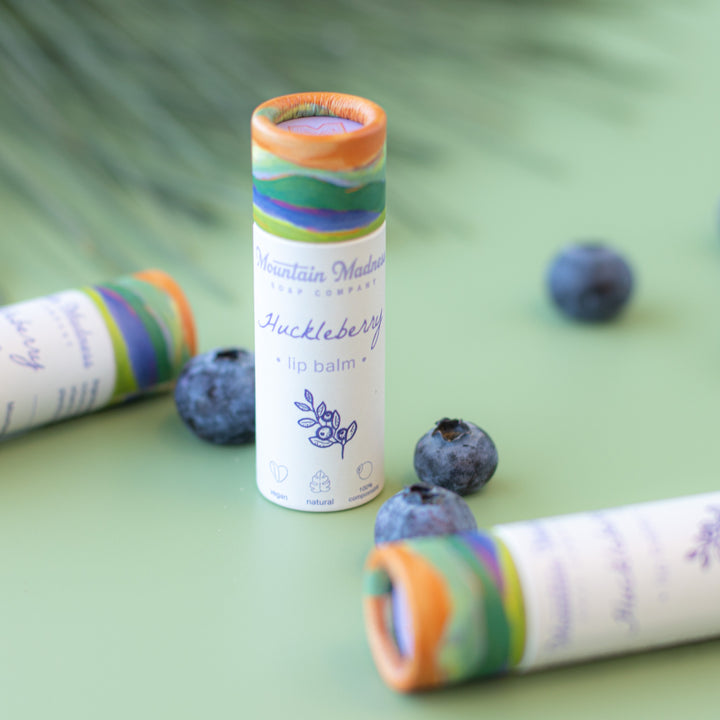 Huckleberry Lip Balm, a handcrafted lip balm. Berry flavor with coconut oil, sunflower oil, and vitamin E.