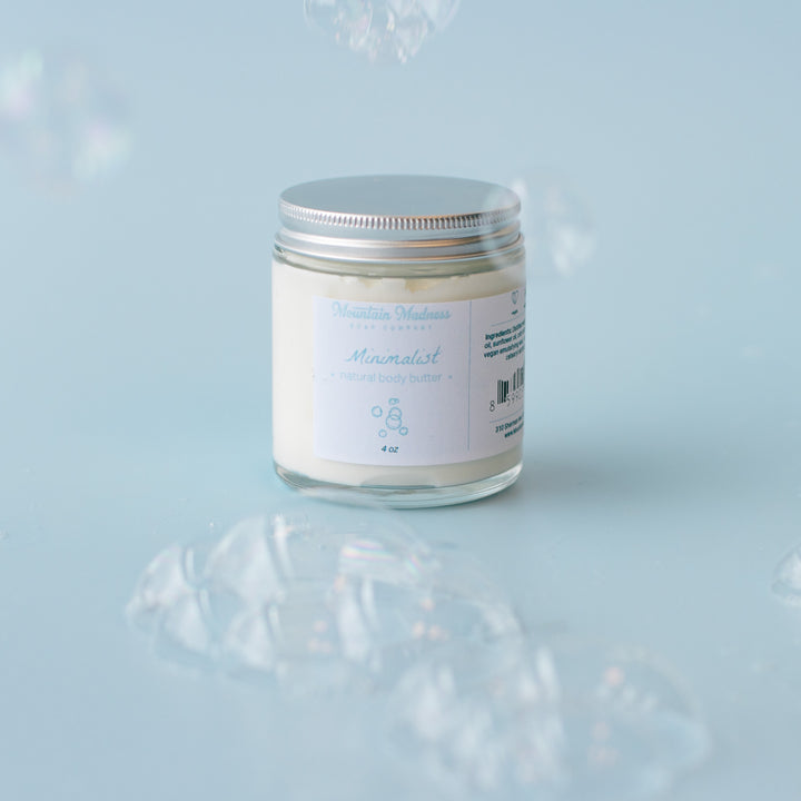 Minimalist Body Butter, a handcrafted body butter. Unscented formula with shea butter, jojoba oil, and cocoa butter.