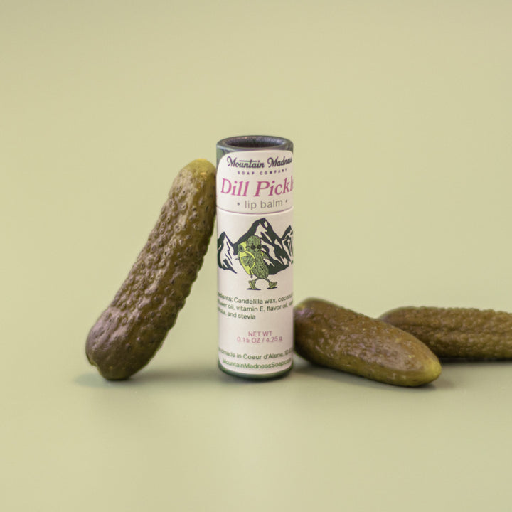 Dill Pickle Lip Balm, a handcrafted lip balm. Foodie flavor with coconut oil, sunflower oil, and vitamin E.