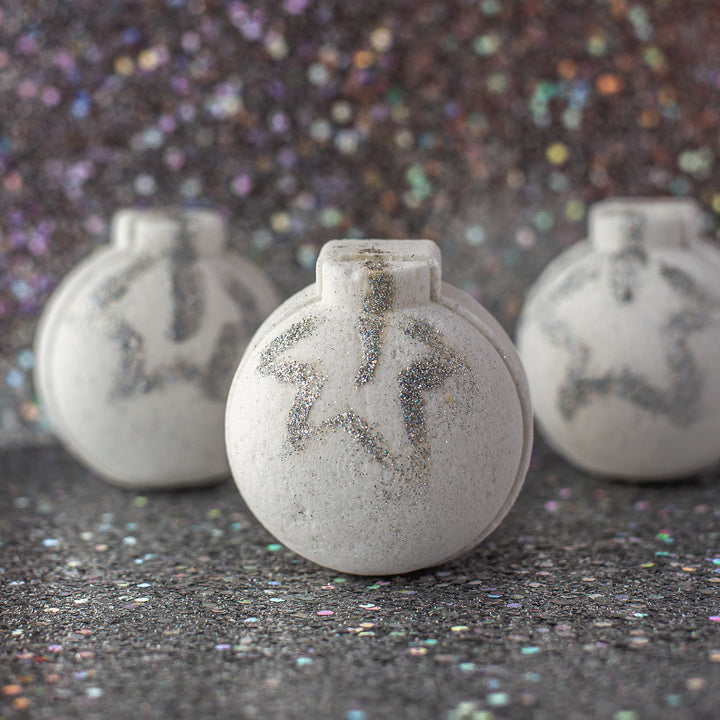 Glitter Bath Bomb, a handcrafted bath product. Fruity berry scent with cocoa butter, olive oil, and eco-friendly glitter.
