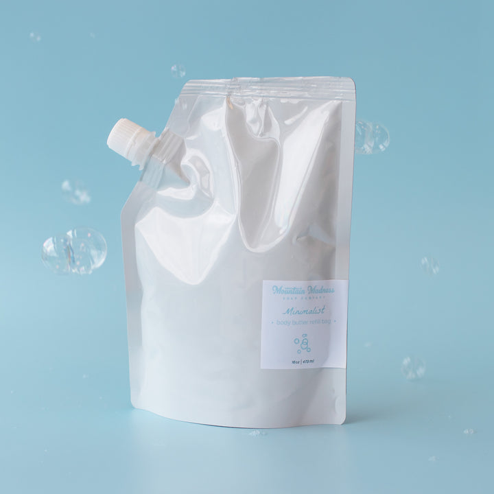 Minimalist Body Butter, a handcrafted body butter refill. Unscented formula with shea butter, jojoba oil, and cocoa butter.