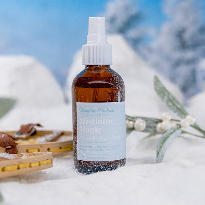 Mistletoe Magic Linen + Room Spray, a handcrafted room spray. Berry and fruity scent with floral and vanilla notes.