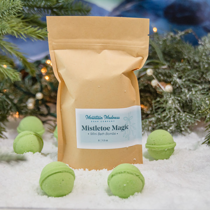 Mini Bath Bombs- Mistletoe Magic, a handcrafted bath bomb set. Berry and fruity scent with cocoa butter and Epsom salt.