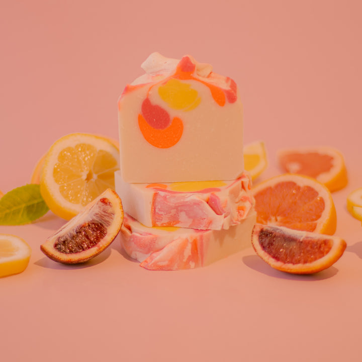 Sunrise Soap - Citrus-scented handcrafted bar soap with grapefruit and coconut oil in kraft paper packaging