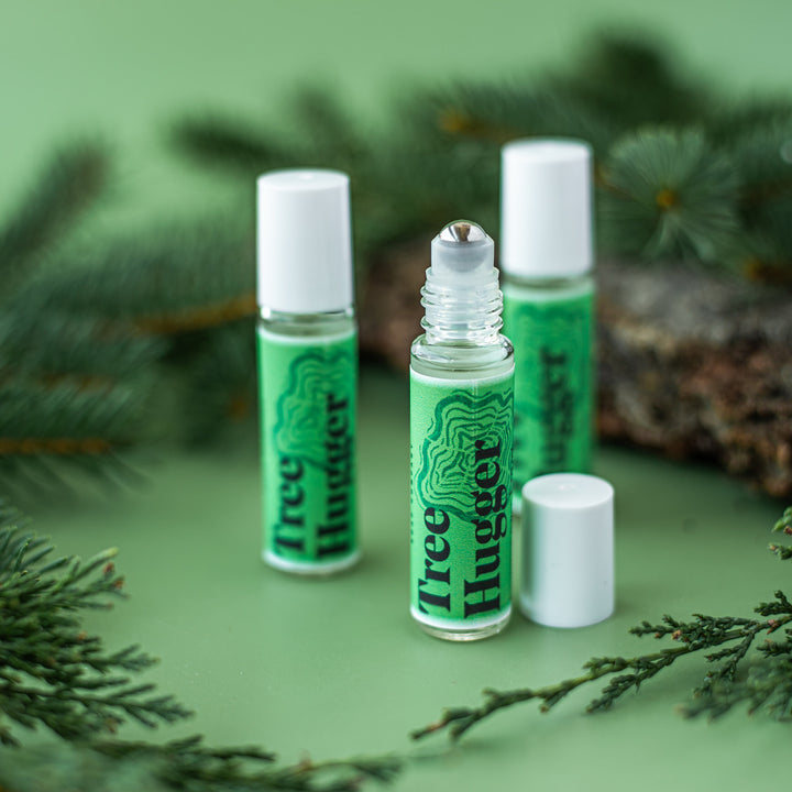 Tree Hugger Perfume Rollerball, a handcrafted perfume rollerball. Woodsy scent with cedarwood, pine, and eucalyptus.